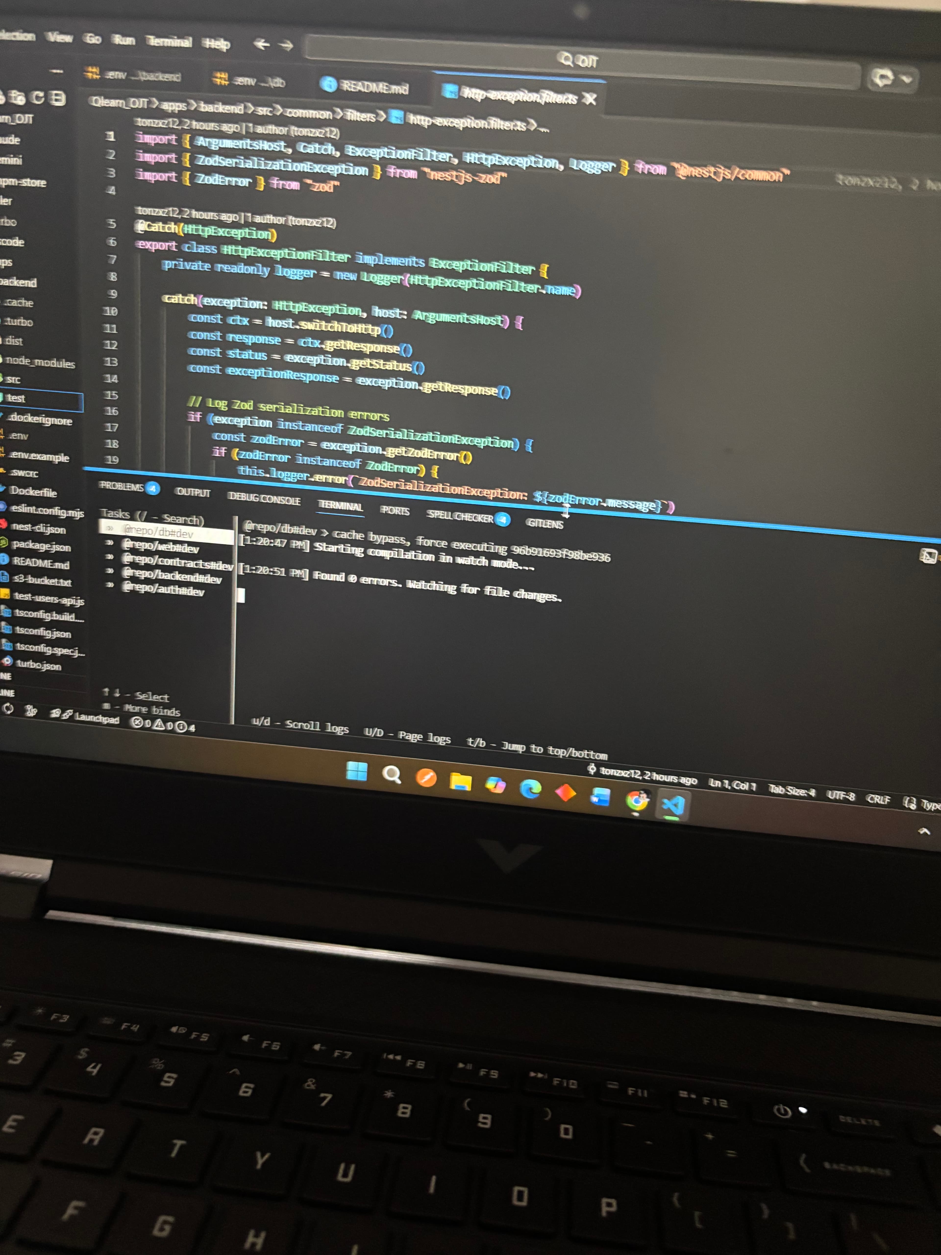 Laptop showing terminal and code editor